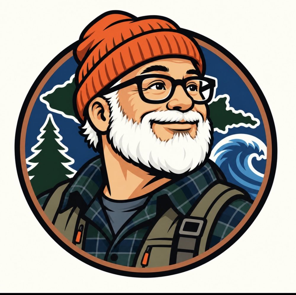 Round portrait illustration of the WildYooper mascot — a smiling white-bearded man in an orange knit cap and glasses, with pine trees, the Upper Peninsula outline, and a Lake Superior wave behind him