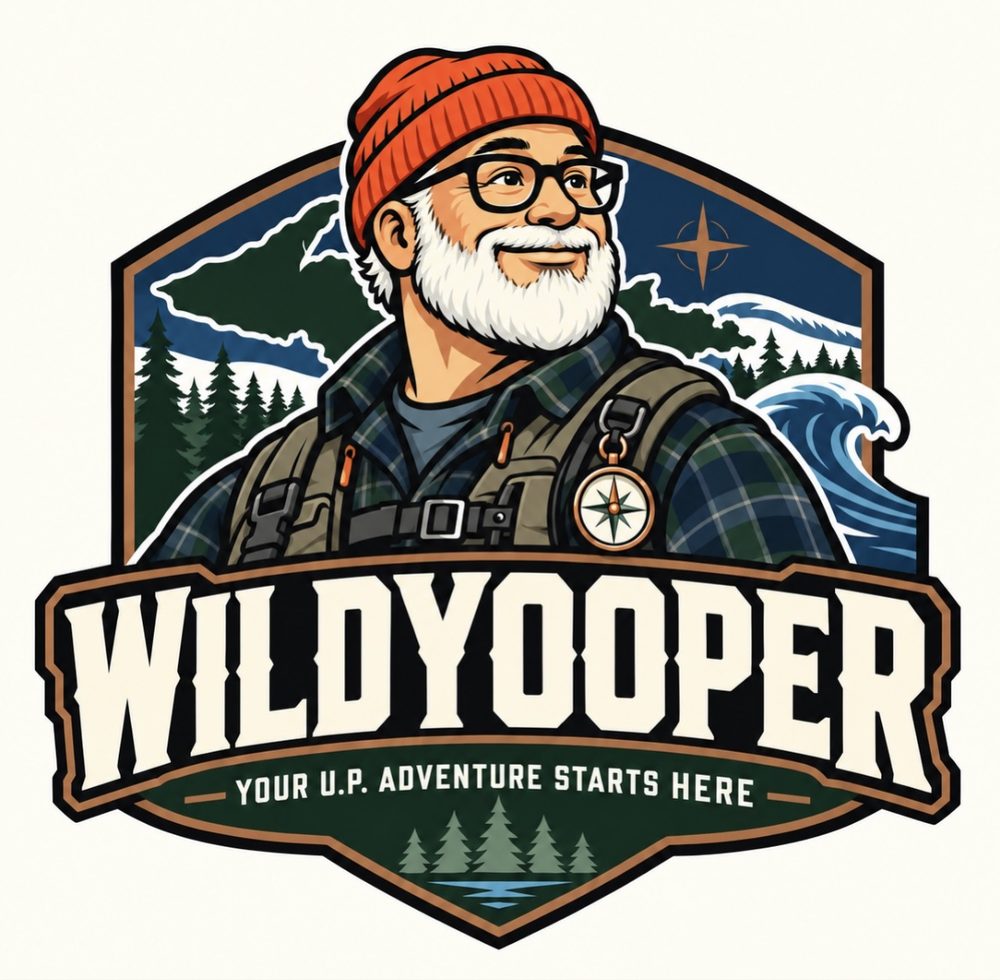 The WildYooper logo — the smiling white-bearded mascot in an orange cap above the words WILDYOOPER and the motto 'Your U.P. Adventure Starts Here'